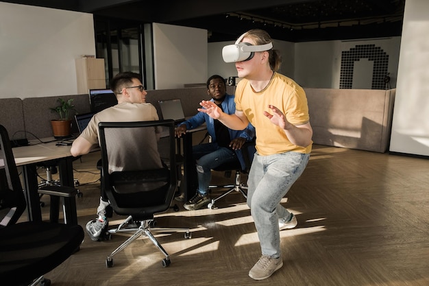 it-development-team-working-vr-project-man-wearing-vr-headset-touching-something-virtual-normal